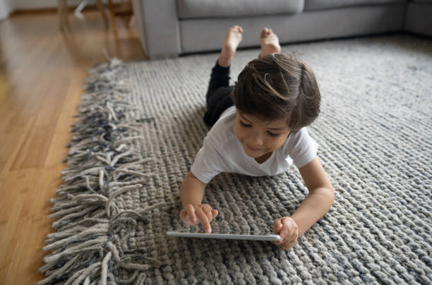 Girl lying on rug | The FloorWorks | Bethlehem, NH