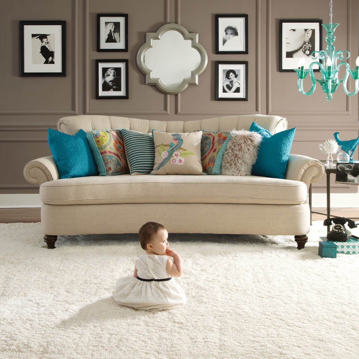 Cute baby sitting on carpet flooring | FloorWorks | Bethlehem, NH