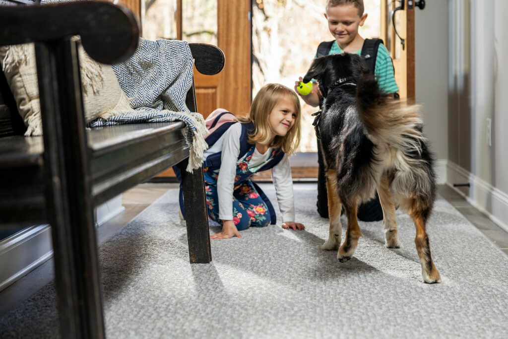 Kids playing with dog on carpet floors | The FloorWorks | Bethlehem, NH